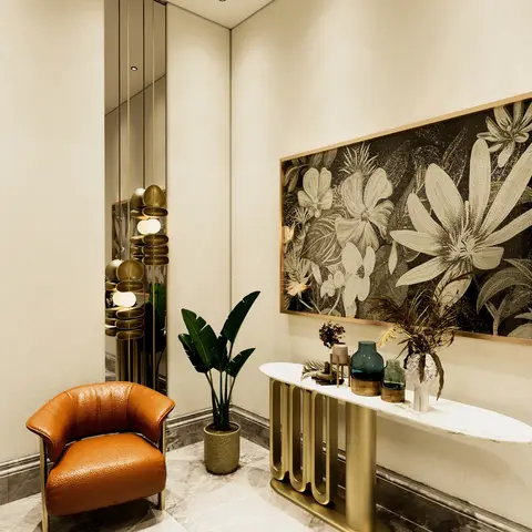 An entrance foyer with a gold wave-base marble console table styled with vases, a large floral mosaic wall art panel and an