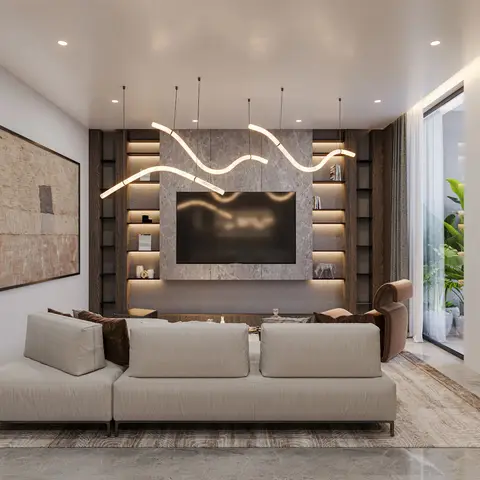 A low-slung beige modular sofa faces a marble-clad TV wall flanked by backlit open shelving, under sculptural wavy pendant