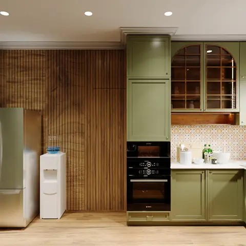 A sage-green shaker kitchen with vertical fluted wood wall panelling, an arched glazed cabinet, and a patterned tile