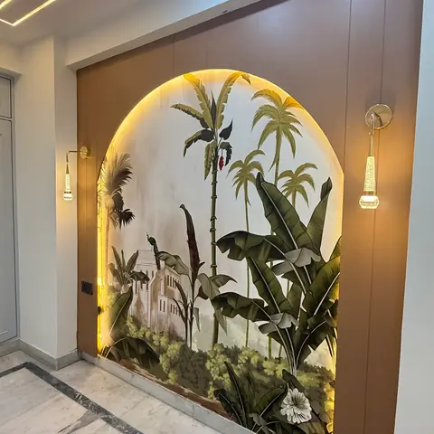 Foyer with a backlit arched wall niche painted with a tropical palm and peacock mural, flanked by brass drop wall sconces