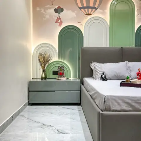 Child's room where backlit mint and white arch panels step up in front of a blush hot-air-balloon mural, beside a mint gloss