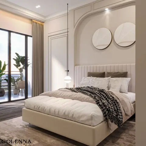 King bedroom with a channel-tufted headboard set in an arched moulded wall niche, twin circular textured wall discs, and a