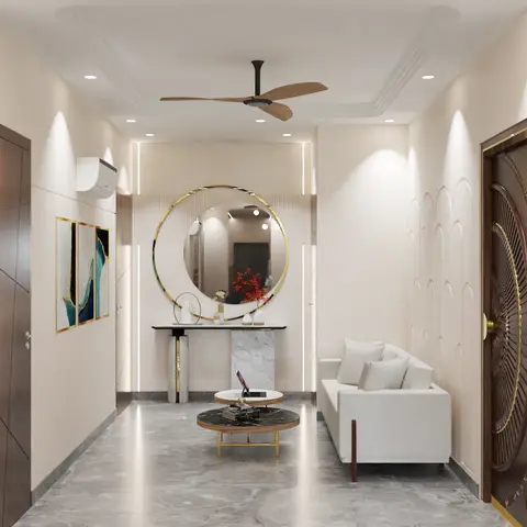 Entryway foyer with an ornate brass-ringed main door, a round gold-framed mirror over a marble console, and arched wall