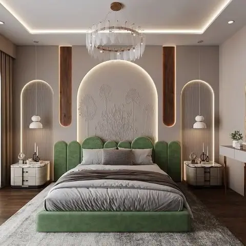 bedroom with a sage-green scalloped upholstered bed under a sculpted floral plaster headboard panel flanked by backlit