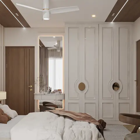 Master bedroom with a tufted upholstered bed, a paneled off-white wardrobe with brass circular mirror inlays, a mirrored