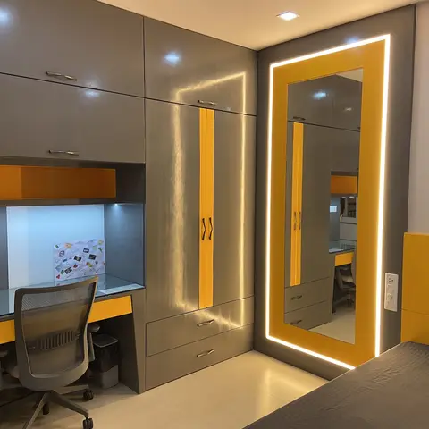 Kids' bedroom with a grey and mustard-yellow wardrobe and backlit full-length mirror, paired with a built-in study desk and