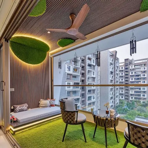 Home balcony with artificial-turf flooring, a wood-slat ceiling with backlit moss art discs, a built-in cushioned daybed,