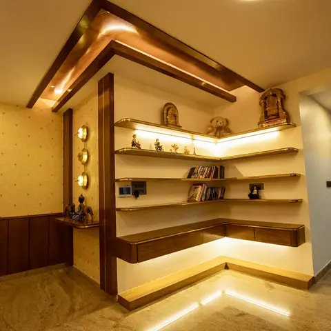 Entrance foyer corner with backlit floating display shelves holding curios and books, framed by dark wood trim and gold
