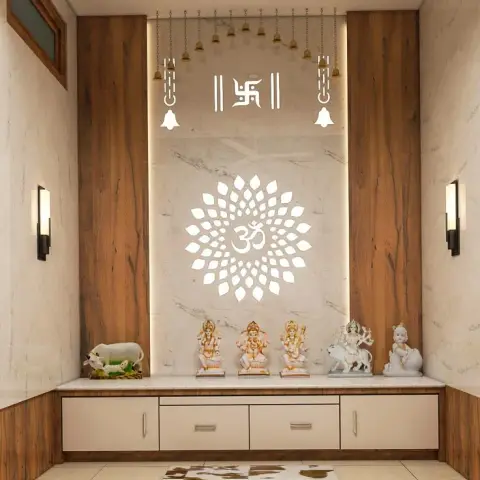 A pooja room with a backlit lotus-and-Om cutout motif on a marble panel, flanked by wood-clad walls, hanging brass temple