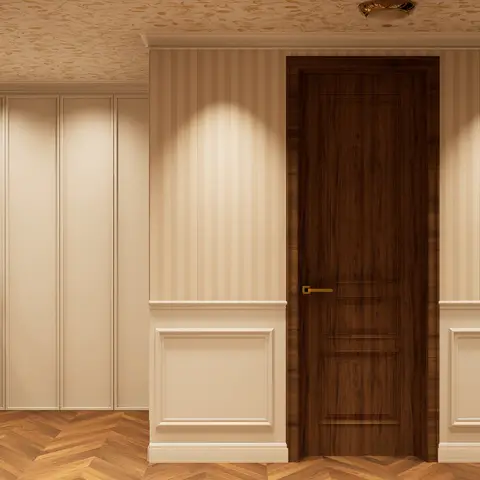 Entrance foyer with striped wallpaper above wainscot panel moulding, a dark wood-veneer door with brass handle, chevron