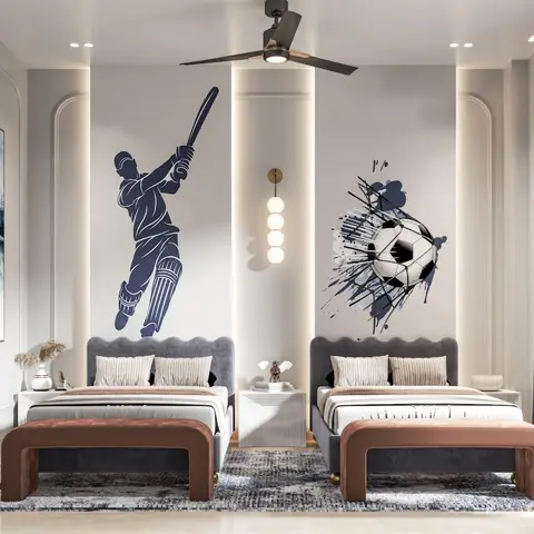 A shared kids' bedroom with twin grey upholstered beds under wall murals of a cricket batsman and a soccer ball, rust-toned