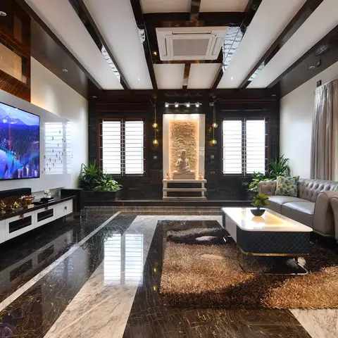 Double-height living room with a book-matched black-and-white marble floor, dark exposed-beam ceiling, stone-clad Buddha