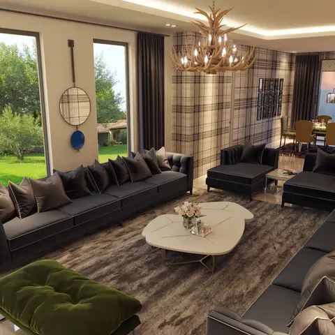 Open-plan living and dining space with a rustic antler chandelier, charcoal velvet sofas facing an organic-shaped marble