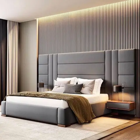 King bed with a tall channel-tufted grey headboard against a backlit vertical-slat wood accent wall, flanked by floating