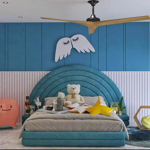 A kids' bedroom with a scalloped teal upholstered bed, a blue board-and-batten and white fluted panelling wall, angel-wing