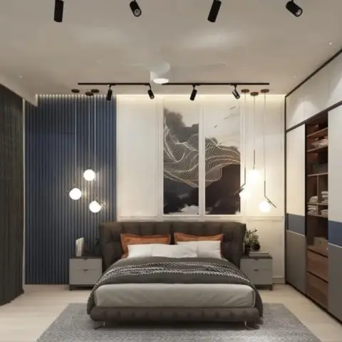 Bedroom with a blue fluted-panel headboard wall featuring a wave-pattern art panel, exposed bulb pendant lights, and a