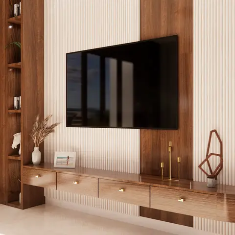 Living room TV wall with mixed walnut-veneer and fluted cream panelling, a curved floating TV console with brass drawer