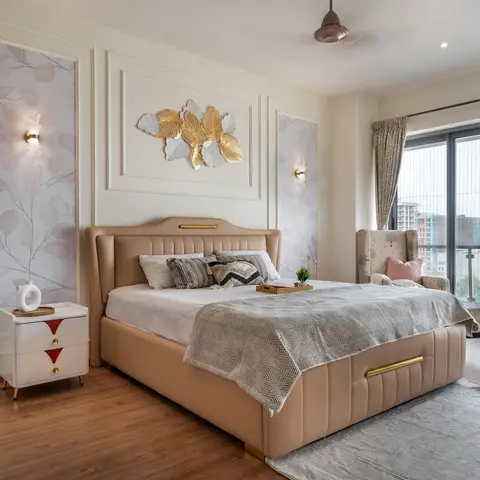 Master bedroom with a tufted beige leather bed, gold leaf wall art, moulded wall panels with botanical wallpaper inserts,