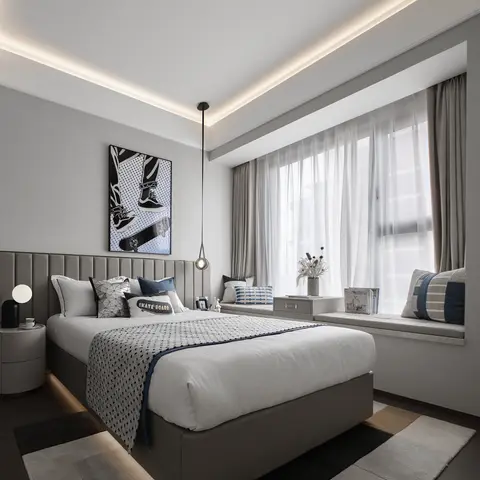 A teen bedroom with a channel-tufted grey headboard, skateboard-themed pop art, and a built-in bay-window seat behind