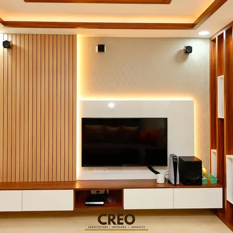 Living room TV wall with a fluted wood slat panel beside a backlit diamond-textured accent wall, a floating two-tone TV