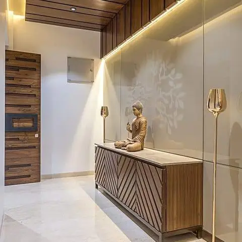 Entrance foyer with a wood-slat ceiling, a chevron-pattern wood console styled with a brass Buddha statue and matching brass