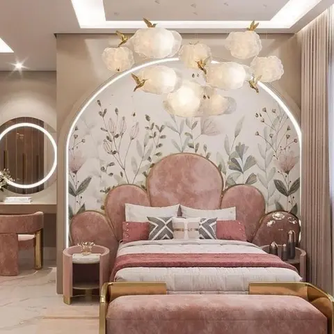 Girl's bedroom with a scalloped blush-pink velvet headboard under an arched floral mural wall, lit by a cluster of