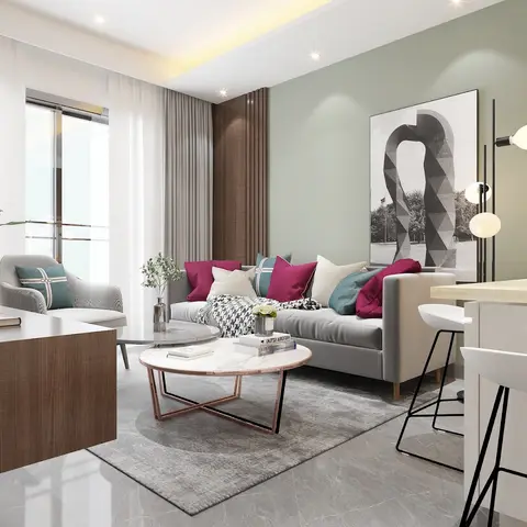 Living room with a sage-green accent wall, a grey sofa styled with magenta and teal cushions, and a round marble coffee