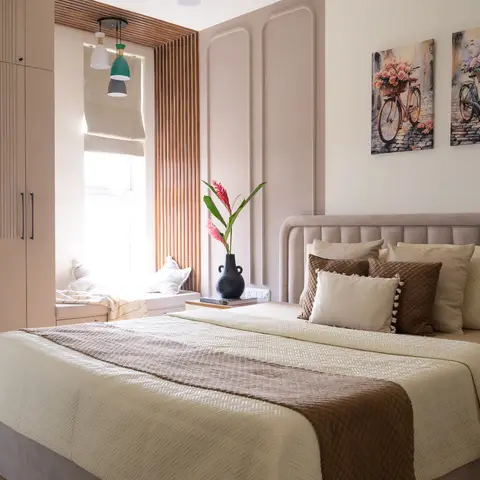 Bedroom with a fluted wardrobe, panel-moulded walls, a wood-slat window seat nook with pendant lights, and a paired