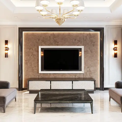 Living room with a stone-clad, cove-lit TV feature wall framed in glossy black trim, a gold chandelier, marble flooring, and